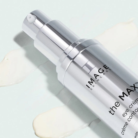 Skincare bottle labeled 'the MAX Eye Creme' by IMAGE Skincare on a light background