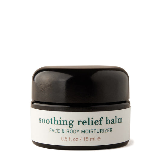 Soothing relief balm jar with black lid on a white background