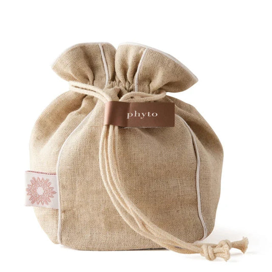 Beige drawstring bag with 'phyto' label on a white background