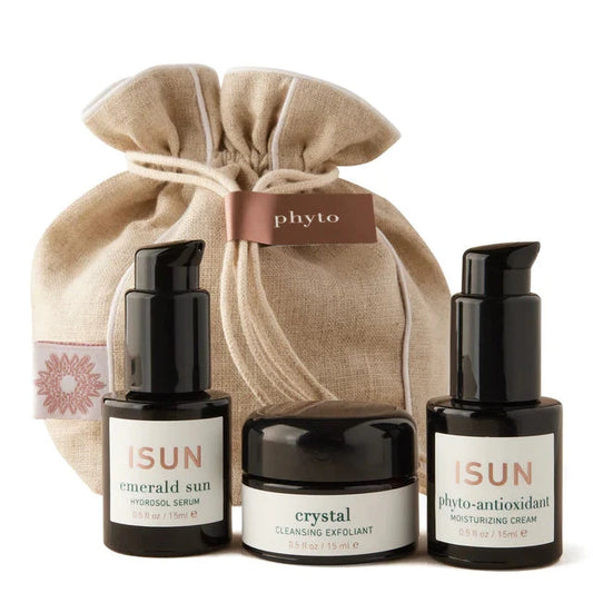 Skincare products with 'phyto' drawstring bag on a white background