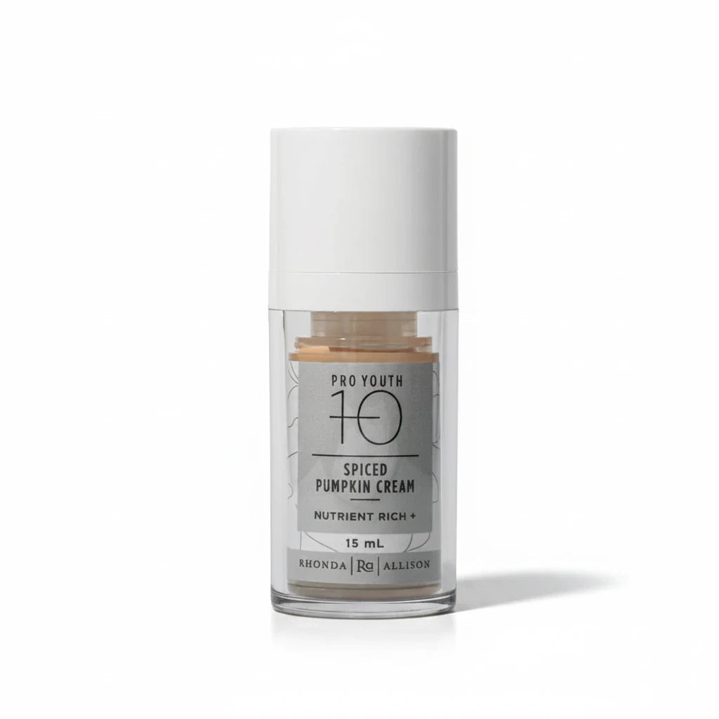 Skincare serum bottle with a white cap and clear body on a white background