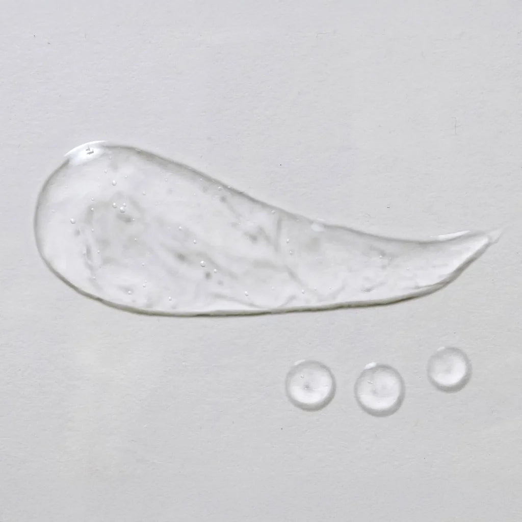 skin script light aloe gel moisturizer smear across a grey background
