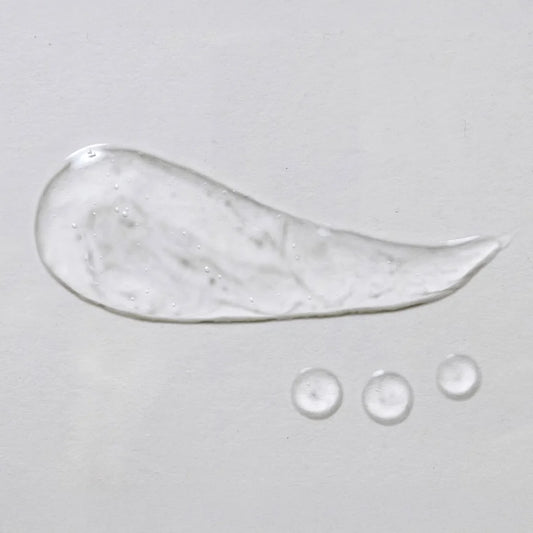 skin script light aloe gel moisturizer smear across a grey background